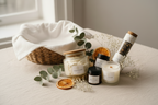 Candle and product set on a light surface with decorative elements